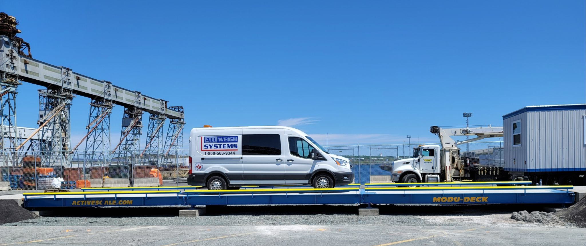 All Weigh Systems service van on a truck scale at an industrial Maritime jobsite